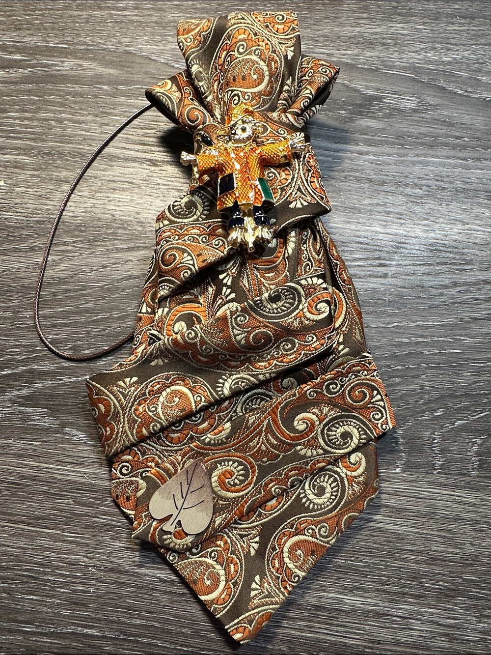 A Beautiful Pasley Orange and Brown Base Necklace Tie with Scarecrow Brooch
